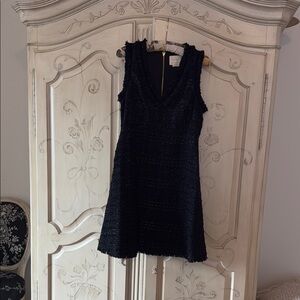 Kate Spade 

Black Mini A-line Sleeveless V-neck Cocktail Dress.

!